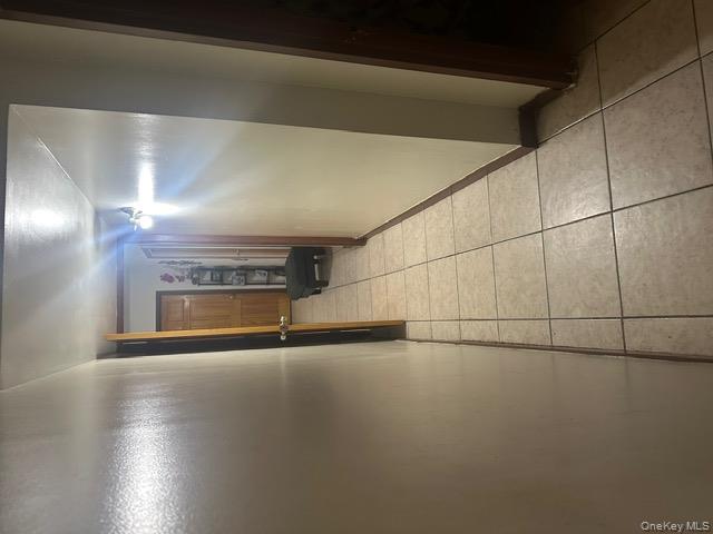 104-29 Roosevelt Avenue Queens, NY 11368 - Photo 3 of 23 a view of hallway with a mirror