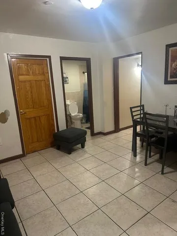 a bedroom with a bed and a mirror