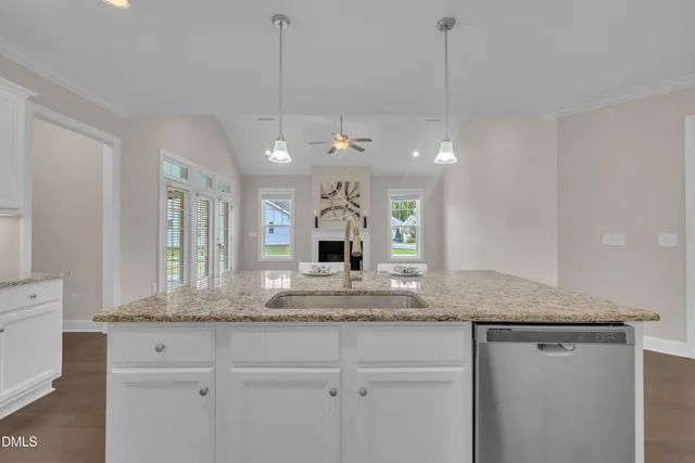 a view of a hallway with wooden floor and closet