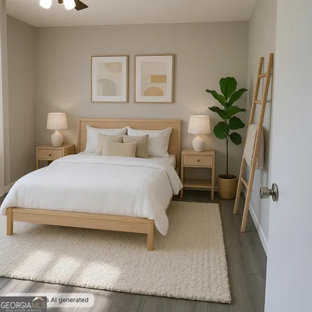 a bedroom with a large bed and a potted plant