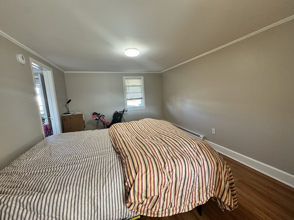 2667 Cranberry Highway, Unit 7 Wareham, MA 02571 - Photo 16 of 17 a bed room with a bed and a mirror