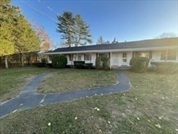 2667 Cranberry Highway, Unit 7 Wareham, MA 02571 - Photo 2 of 17 a view of a house with a yard