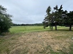 2667 Cranberry Highway, Unit 7 Wareham, MA 02571 - Photo 5 of 17 a view of outdoor space with green field and trees