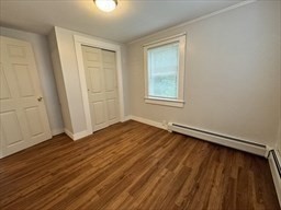 2667 Cranberry Highway, Unit 7 Wareham, MA 02571 - Photo 10 of 17 an empty room with wooden floor and windows