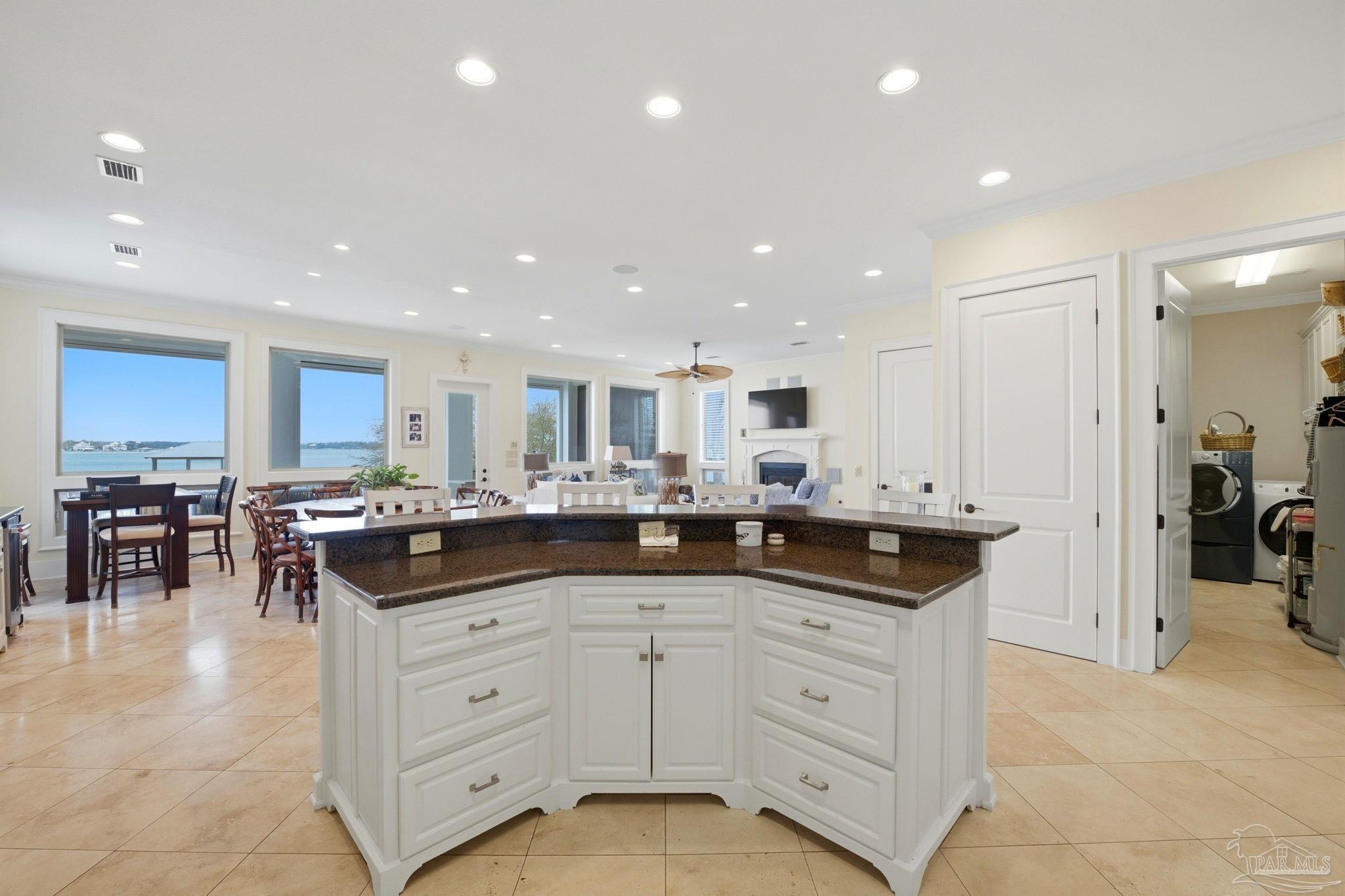 14520 River Road Perdido Key, FL 32507 - Photo 17 of 48 a kitchen with white cabinets and sink