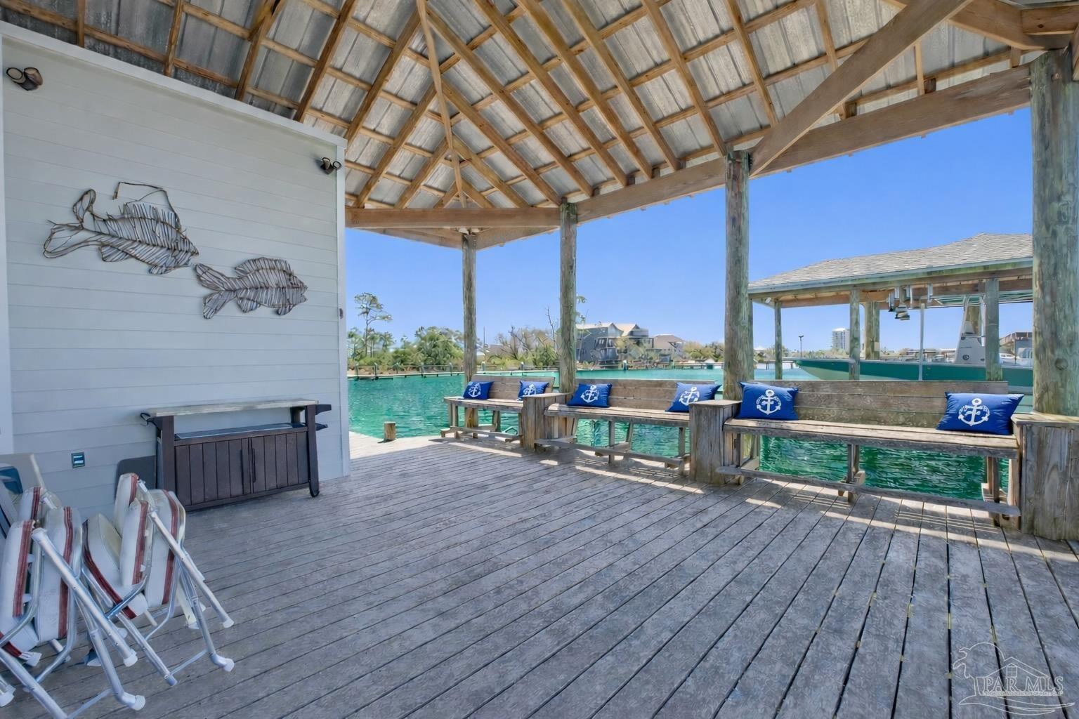 14520 River Road Perdido Key, FL 32507 - Photo 5 of 48 a patio with table and chairs