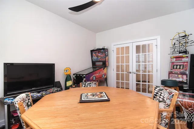 a bedroom with bed and flat screen tv