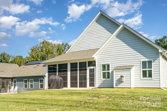 a house that has a large window in front of it