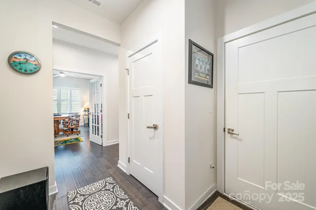 a view of a hallway to a livingroom and a couch
