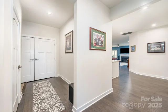 a view of hallway with wooden floor