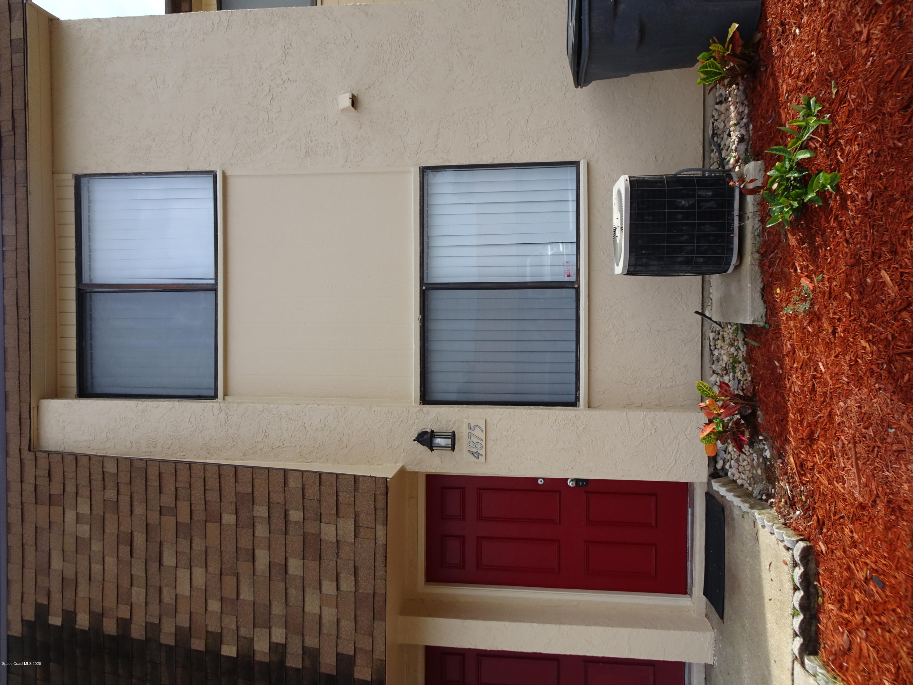 4875 Sisson Road Titusville, FL 32780 - Photo 1 of 14 a view of front door of house