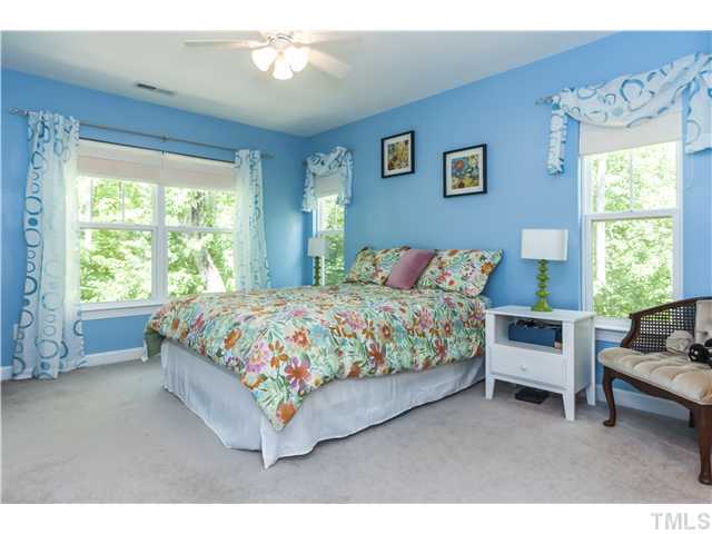 8039 Sunset Branch Court Raleigh, NC 27612 - Photo 15 of 23 The Luxurious master bedroom suite with ceiling fan, a large WIC, garden tub/shower, increased height vanity counter, dual sinks, linen closet, and 4 sunny windows!