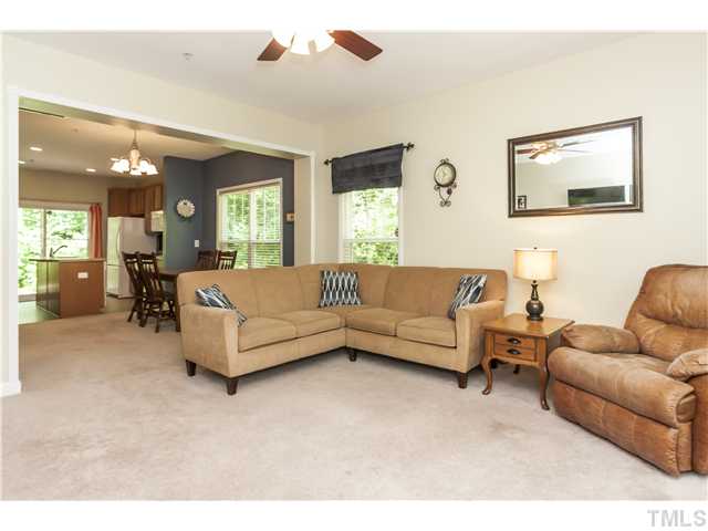 Immaculate and meticulously maintained with 9 ft. smooth ceilings.  The spacious and open living room has an upgraded ceiling fan and the end unit placement of this TH provides tons of natural light coming in from the side of this home.