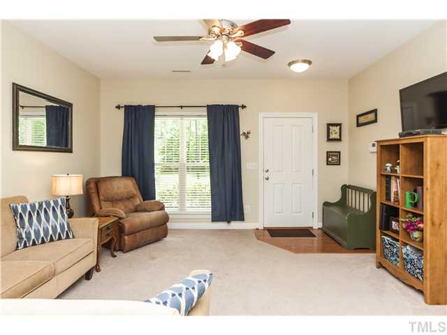 The bonus of this home is that you have none of the typical cars to look at from the front window.  This unit is tucked away on the end with wooded views from the front windows and front porch too!  Amazing!
