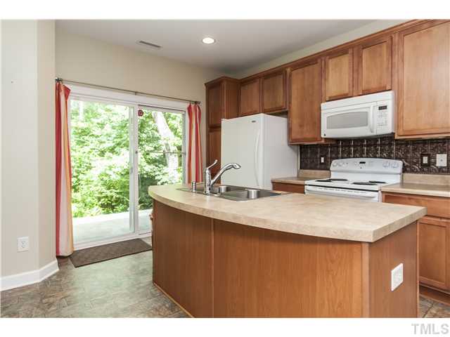 8039 Sunset Branch Court Raleigh, NC 27612 - Photo 9 of 23 The Dream Kitchen has a center island, tall maple cabinets, with tons of storage, including a pantry and recessed lighting. Also included is a FULL Appliance PKG Including Refrigerator, Built-in Microwave, and Washer and Dryer Included!