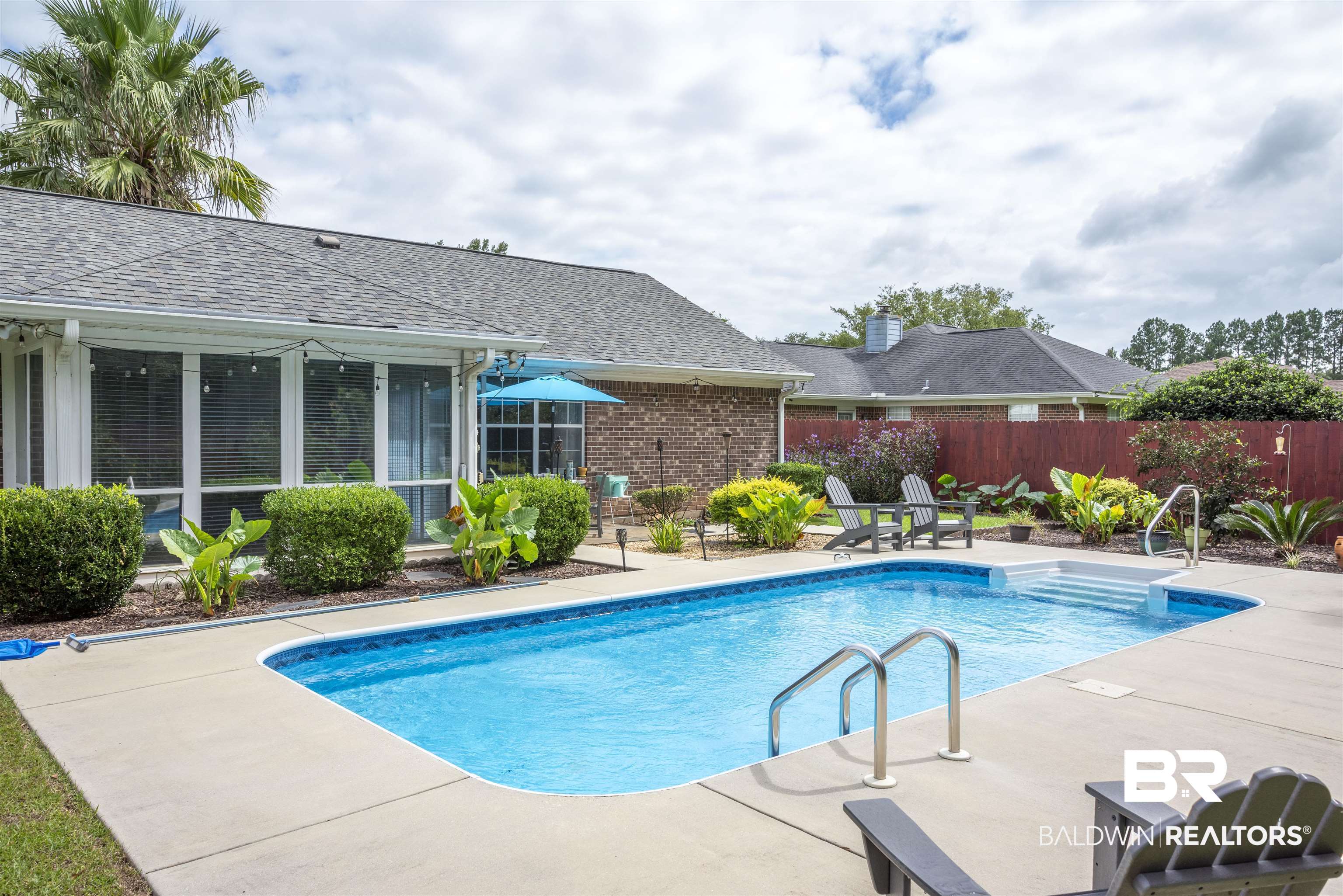 808 Wisteria Lane Foley, AL 36535 - Photo 2 of 19 View of swimming pool featuring a patio area