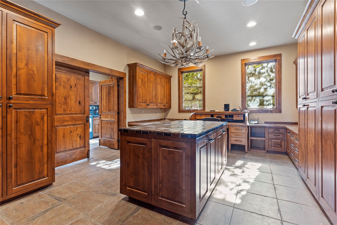 556 Cliff View-lot 53 Loop Harper, TX 78631 - Photo 26 of 40 a kitchen with stainless steel appliances granite countertop a stove refrigerator and cabinets