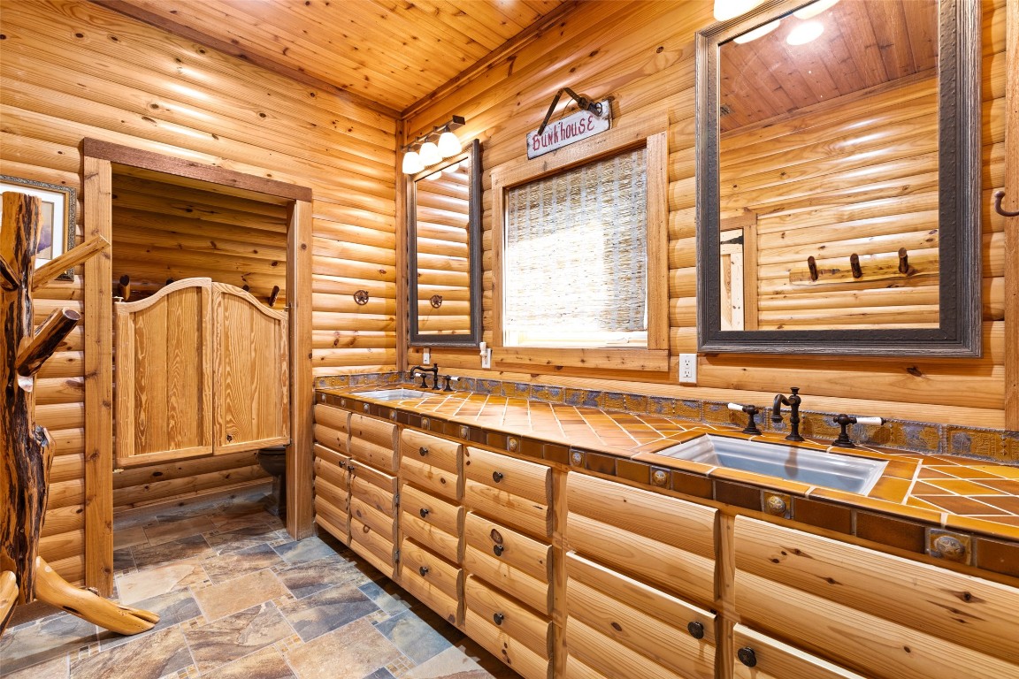 556 Cliff View-lot 53 Loop Harper, TX 78631 - Photo 31 of 40 a bathroom with a sink and a bathtub