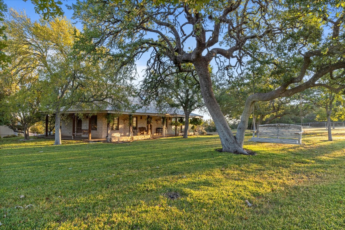 556 Cliff View-lot 53 Loop Harper, TX 78631 - Photo 35 of 40 a view of a house with a big yard and large trees