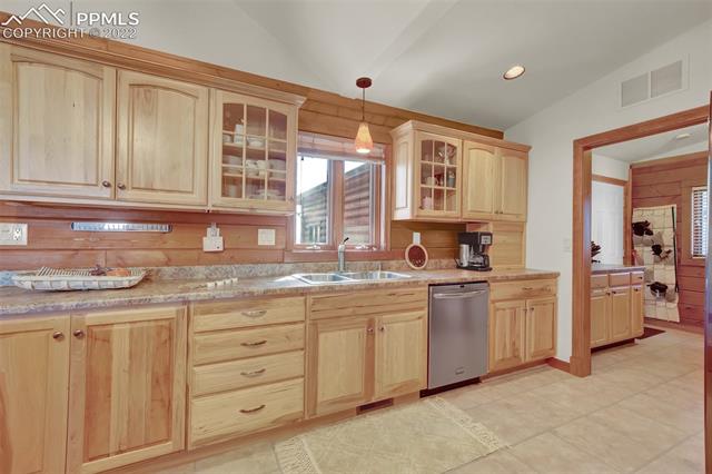 23025 Fix Run Point Calhan, CO 80808 - Photo 13 of 41 Kitchen with Garage access door through Laundry/Mudroom