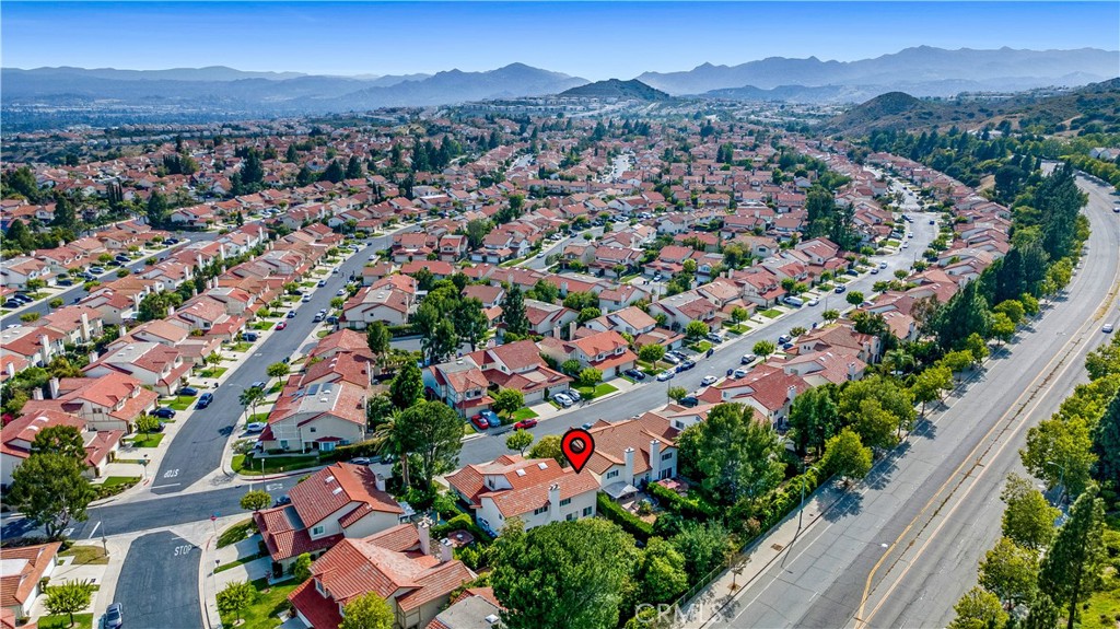 19451 Eagle Ridge Lane Porter Ranch, CA 91326 - Photo 59 of 59 an aerial view of residential houses with outdoor space and trees