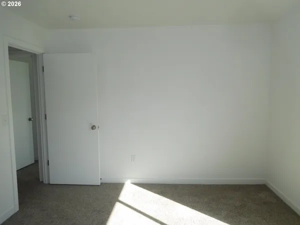 a view of kitchen with wooden floor and electronic appliances