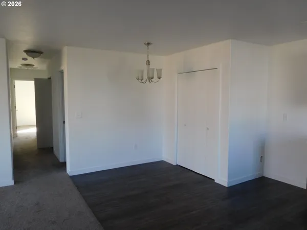 a kitchen with a sink a stove and cabinets