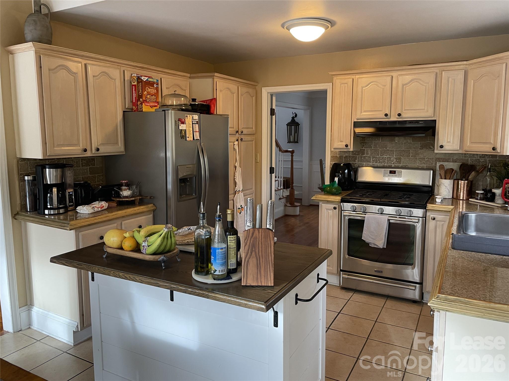 3800 Oldfield Road Charlotte, NC 28226 - Photo 9 of 32 a kitchen with a sink a stove and refrigerator