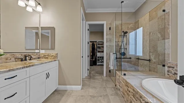 a bathroom with a granite countertop sink mirror and shower