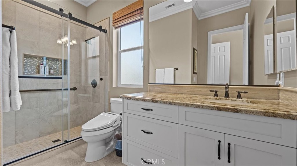 3059 Mill Creek Road Mentone, CA 92359 - Photo 23 of 39 a bathroom with a granite countertop sink a toilet and shower