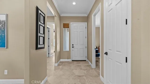a view of a hallway with closet and wooden floor