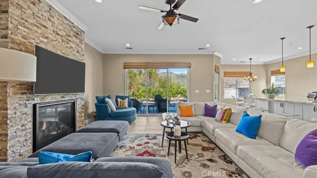 a living room with fireplace furniture and a flat screen tv