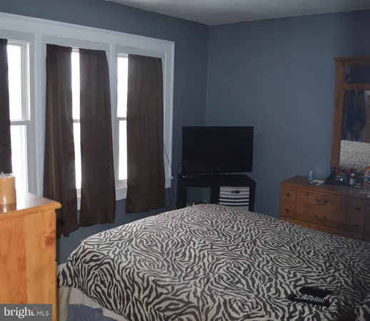 a bedroom with a bed and a closet