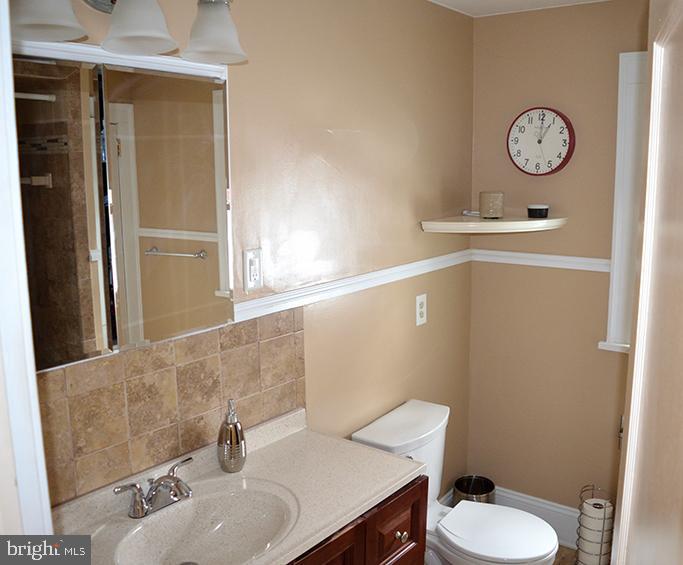 140 Case Avenue Sharon, PA 16146 - Photo 17 of 23 a bathroom with a sink a toilet and a mirror
