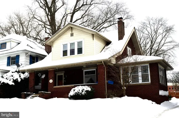 a view of a door with a bench in front of it
