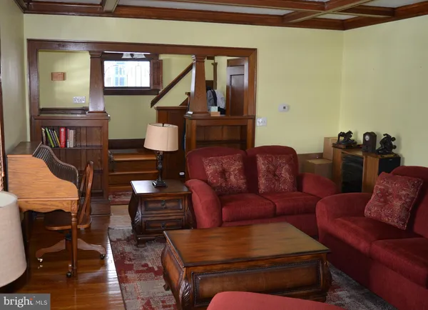 a living room with furniture a couch and a window