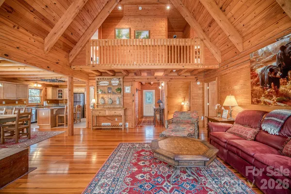 a living room with lots of furniture and a rug