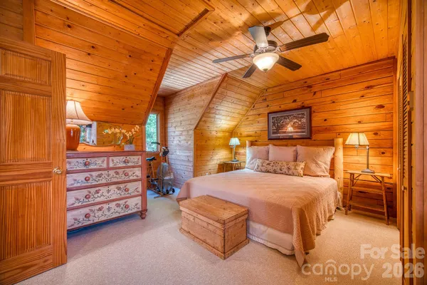 a bedroom with a bed and a cabinets