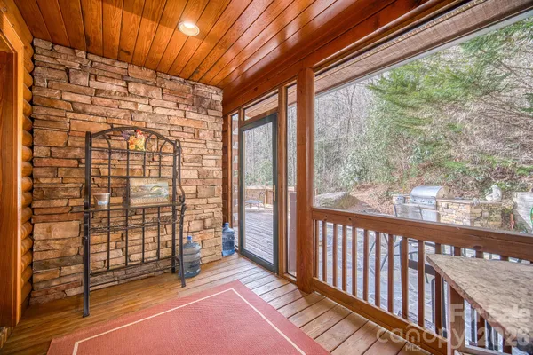 a view of a balcony with wooden floor