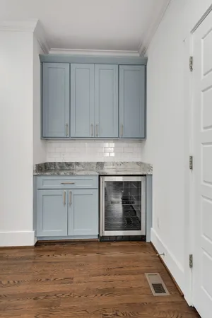 a kitchen with granite countertop a stove fireplace and cabinets