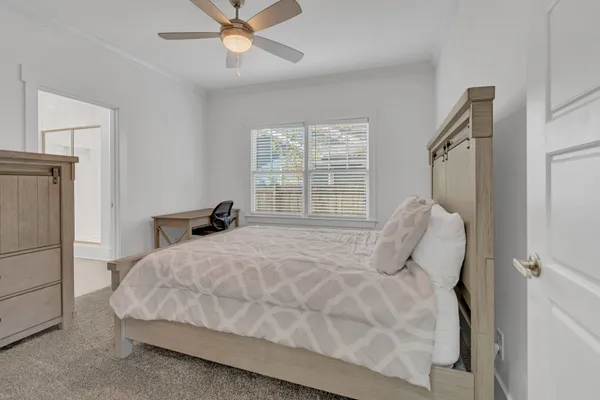 a bedroom with a bed and window