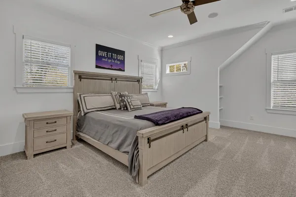 a bedroom with a bed and a television
