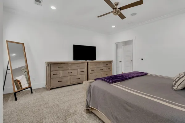 a bathroom with a double vanity sink and mirror with shower