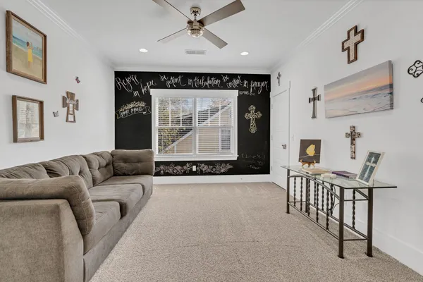 a living room with furniture and a window
