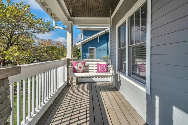 a balcony with wooden floor
