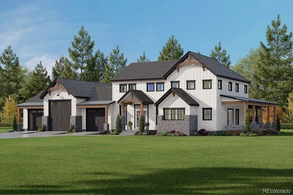 a front view of a house with a garden and trees