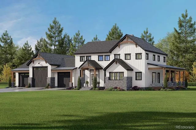 a front view of a house with a garden and trees