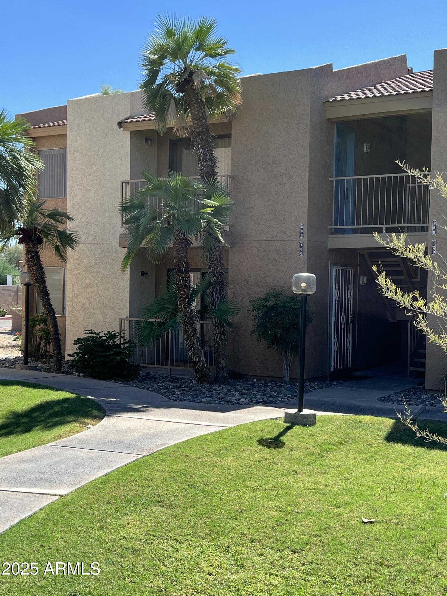 1111 East University Drive, Unit 230 Tempe, AZ 85288 - Photo 1 of 18 a house view with a garden space