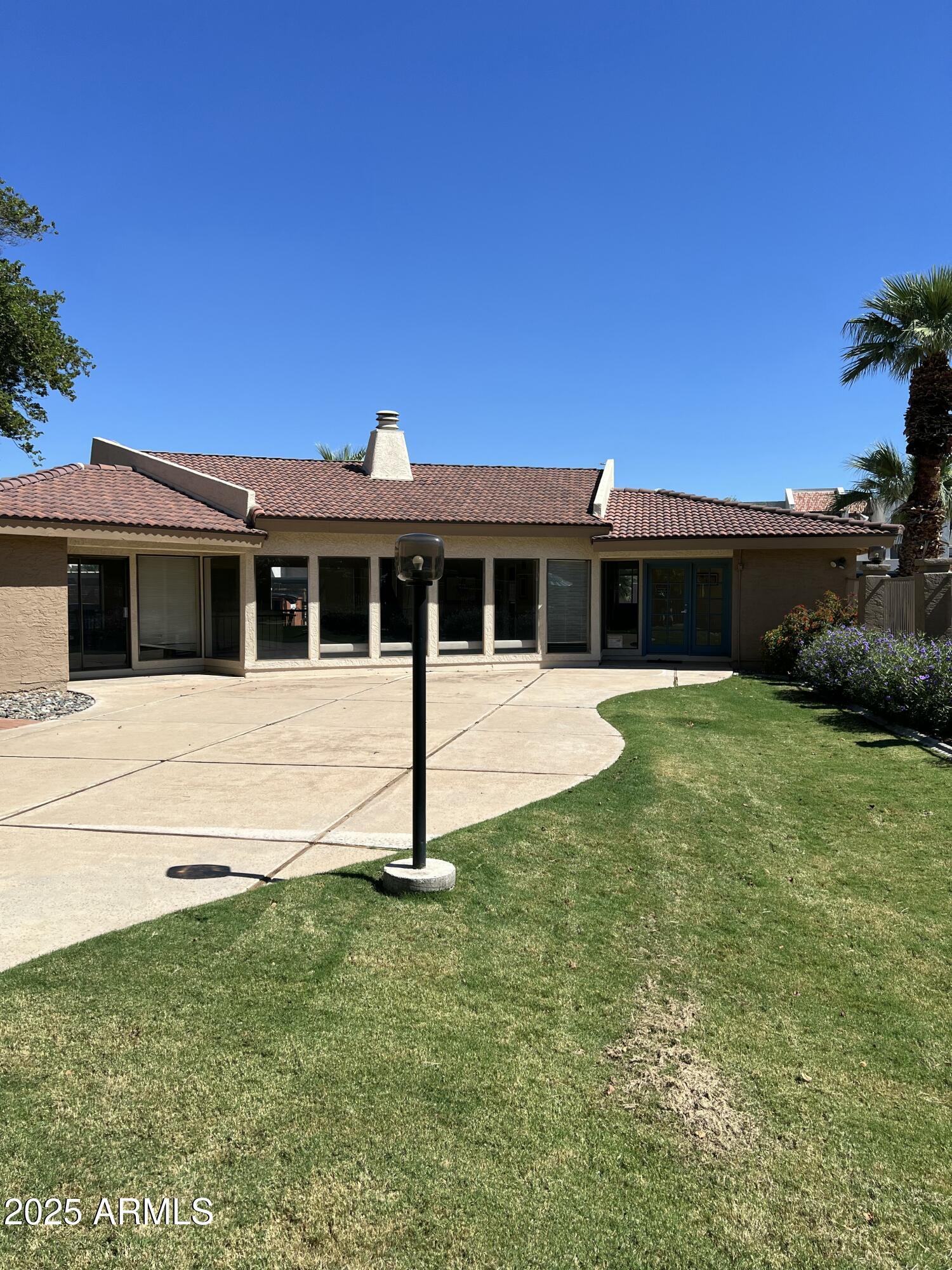 1111 East University Drive, Unit 230 Tempe, AZ 85288 - Photo 11 of 18 a view of a house with a backyard
