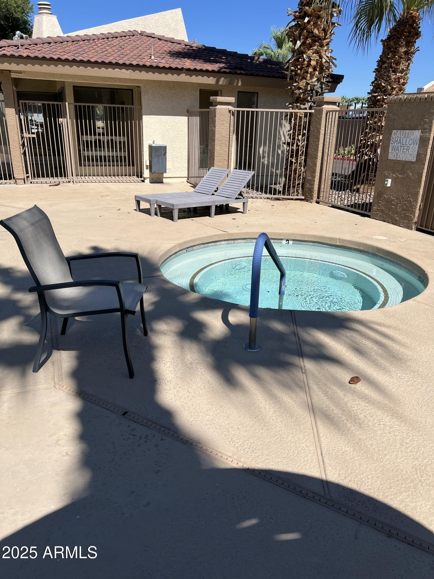 1111 East University Drive, Unit 230 Tempe, AZ 85288 - Photo 12 of 18 a view of a patio with a table and chairs